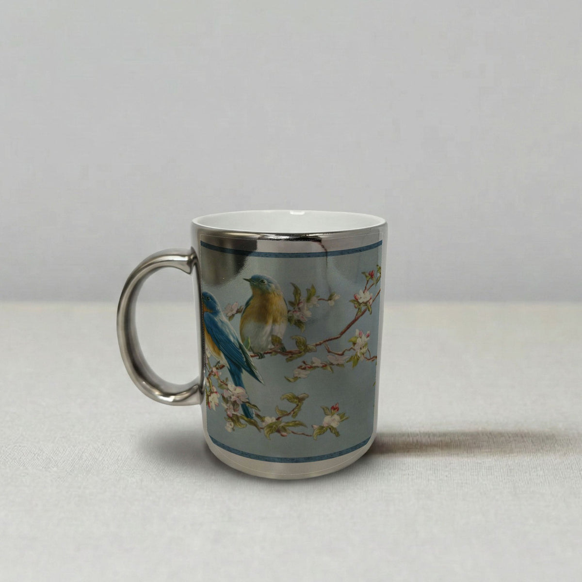 An Oriental Birds Chrome Silver Mug 11oz