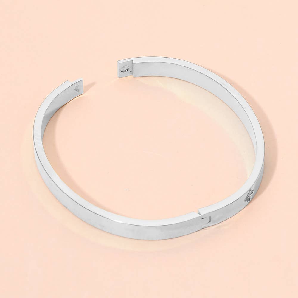 Bracelet jonc articulé en acier inoxydable avec pierres de zircone cubique